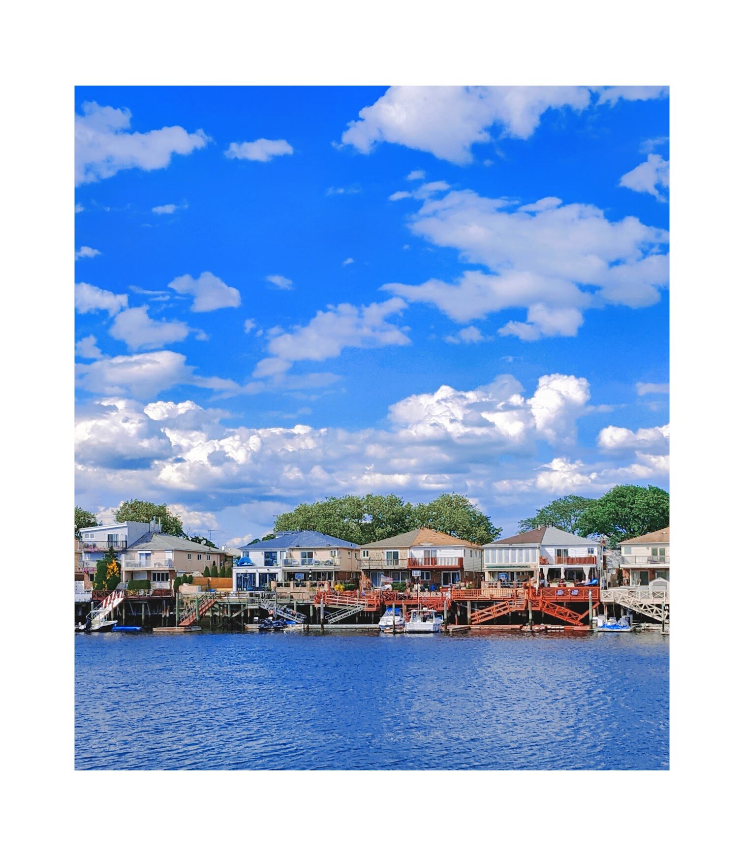 Harbor town with colorful waterfront houses and boats