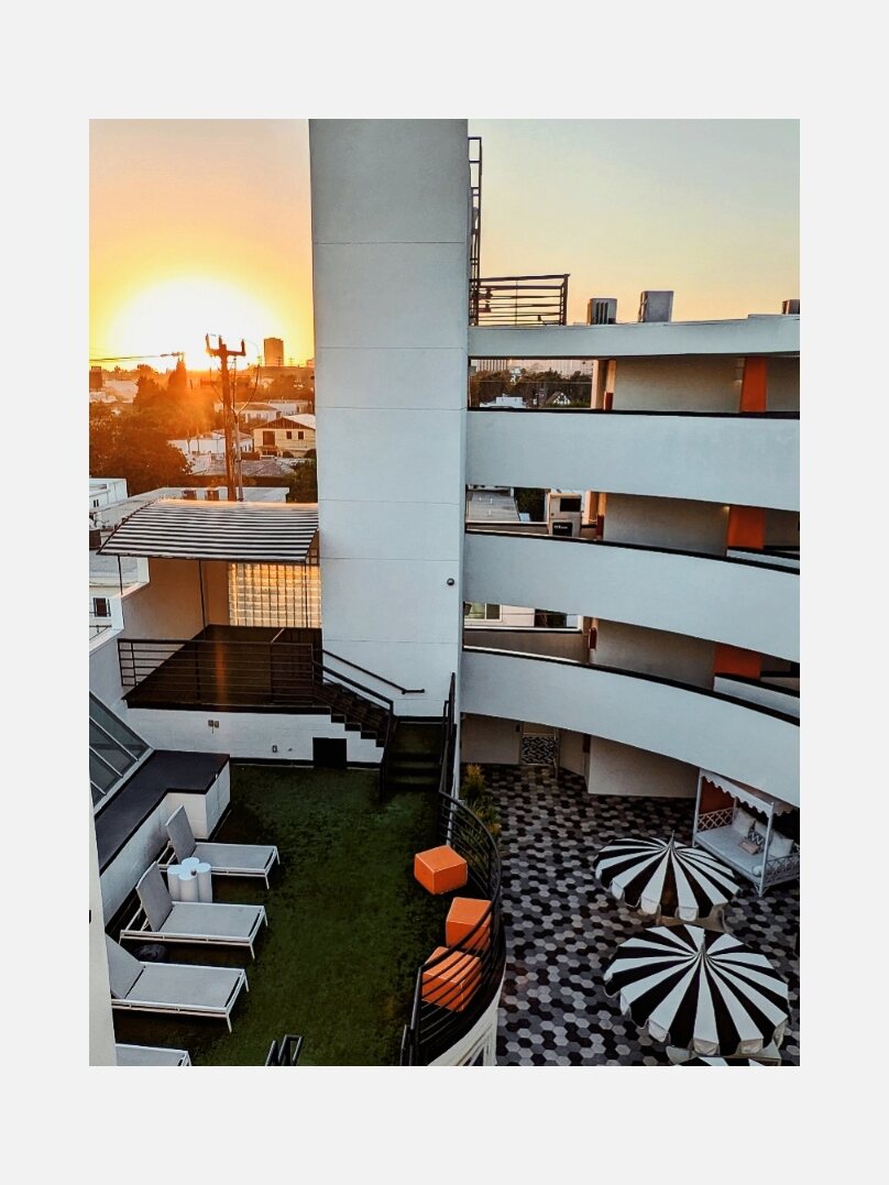 Hotel courtyard architecture glowing at sunset