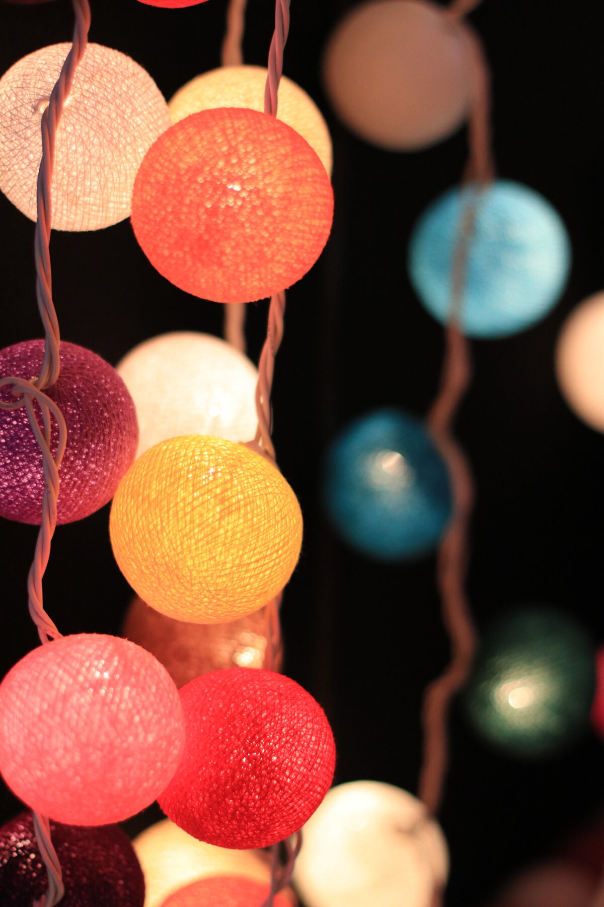 Colorful string lights glowing at dusk