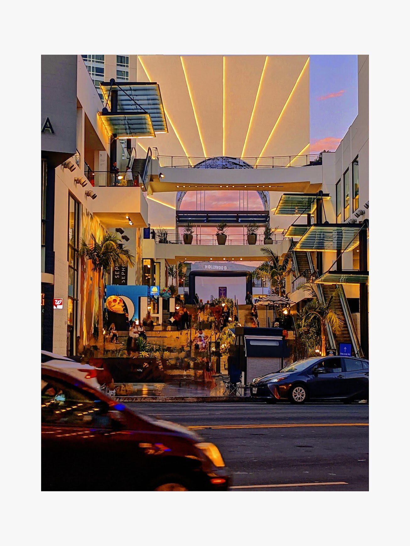 Colorful shopping street glowing with neon lights at dusk
