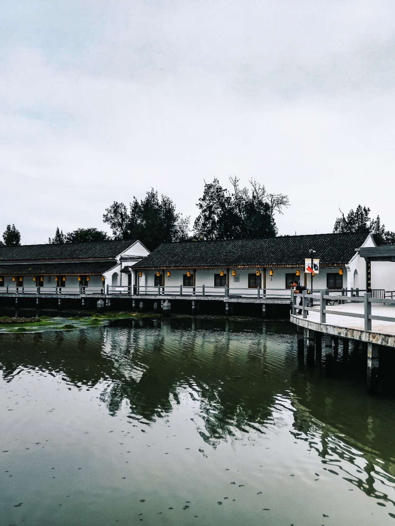 Traditional building reflected in still water