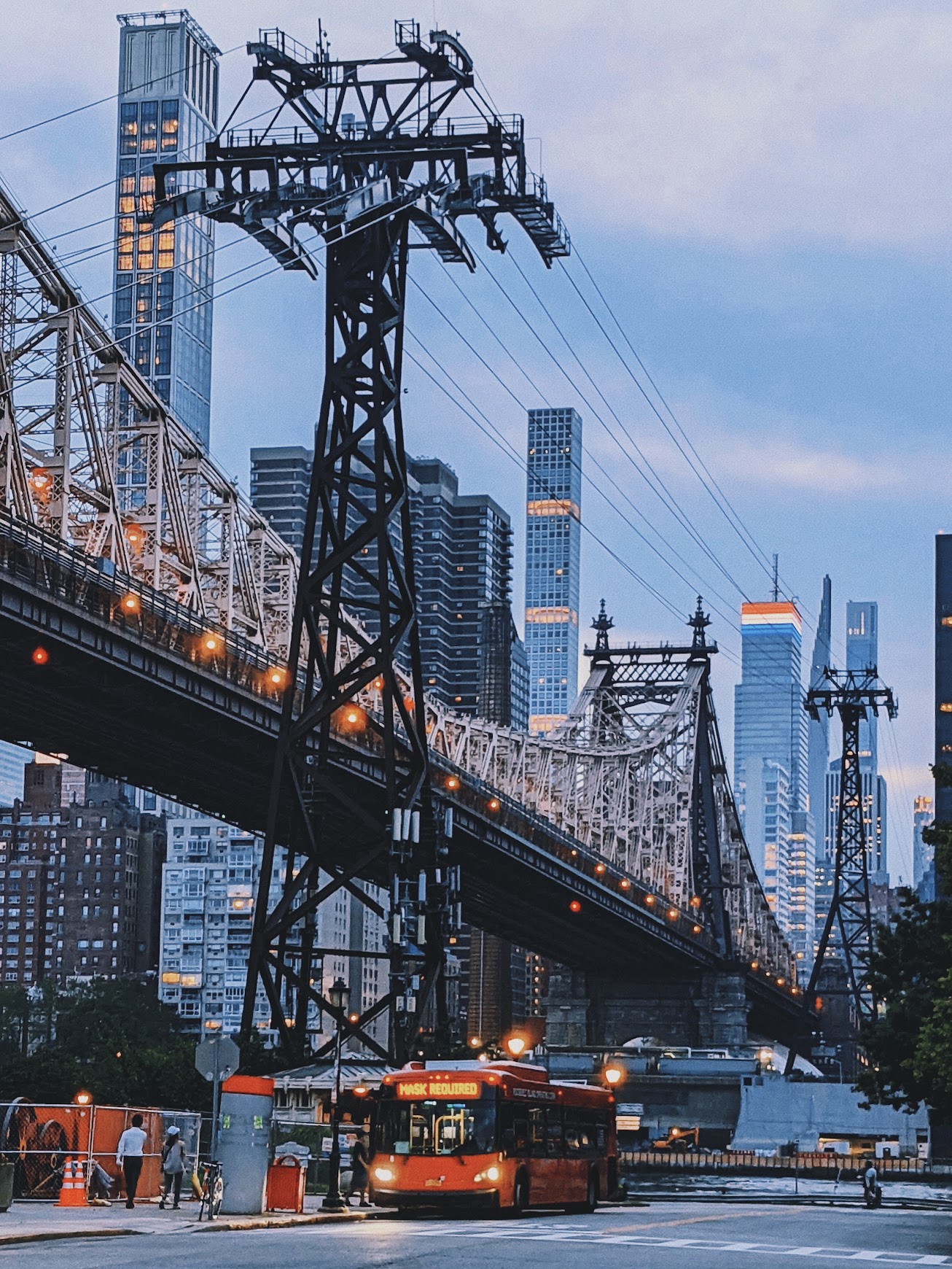 Roosevelt Island tram and bridge over the East River with a passing bus